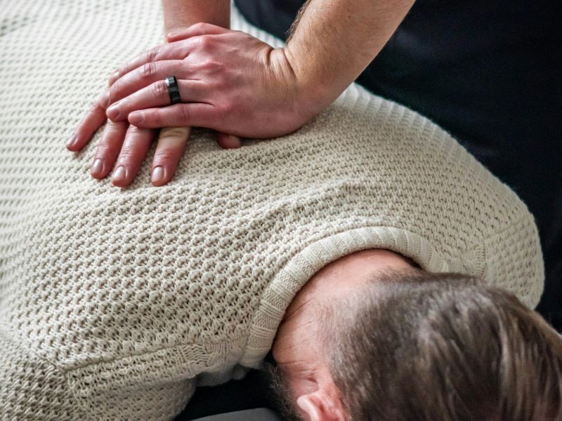 Hands-on care to a patient's upper back