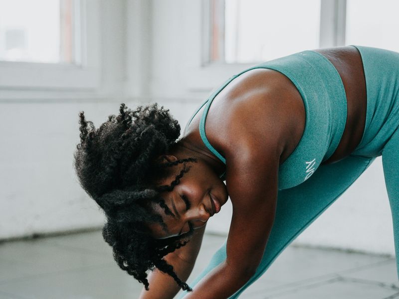 Woman doing a standing hamstring stretch